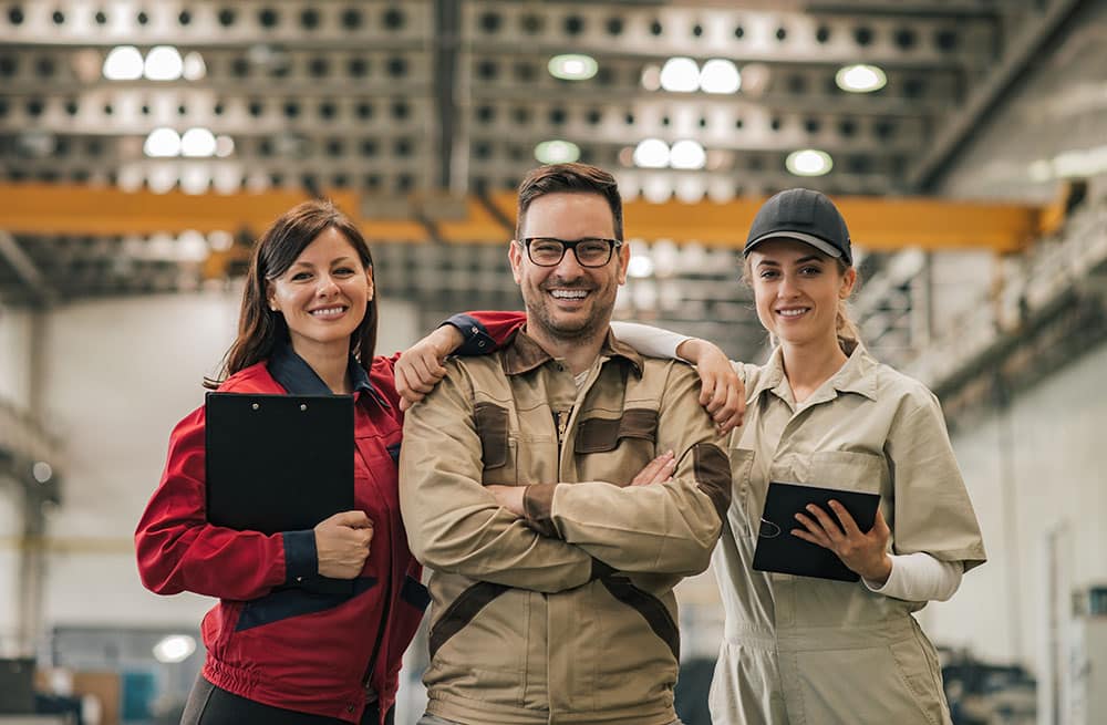 Group portrait of a team of factory workers.