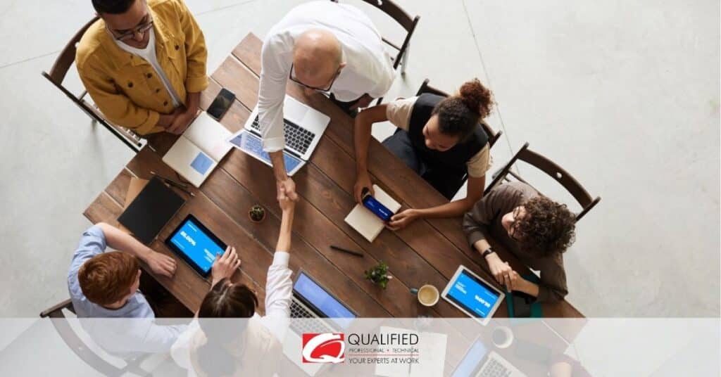 a leader working with his team on a table